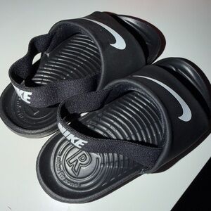 Nike Kids Black Slide Sandals with White Swoosh and Elastic Heel Strap